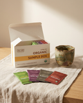 Wu Wei Living Organic Loose Leaf Sample Box with tea packets on a table.