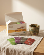 Wu Wei Living Organic Loose Leaf Sample Box with tea packets on a table.